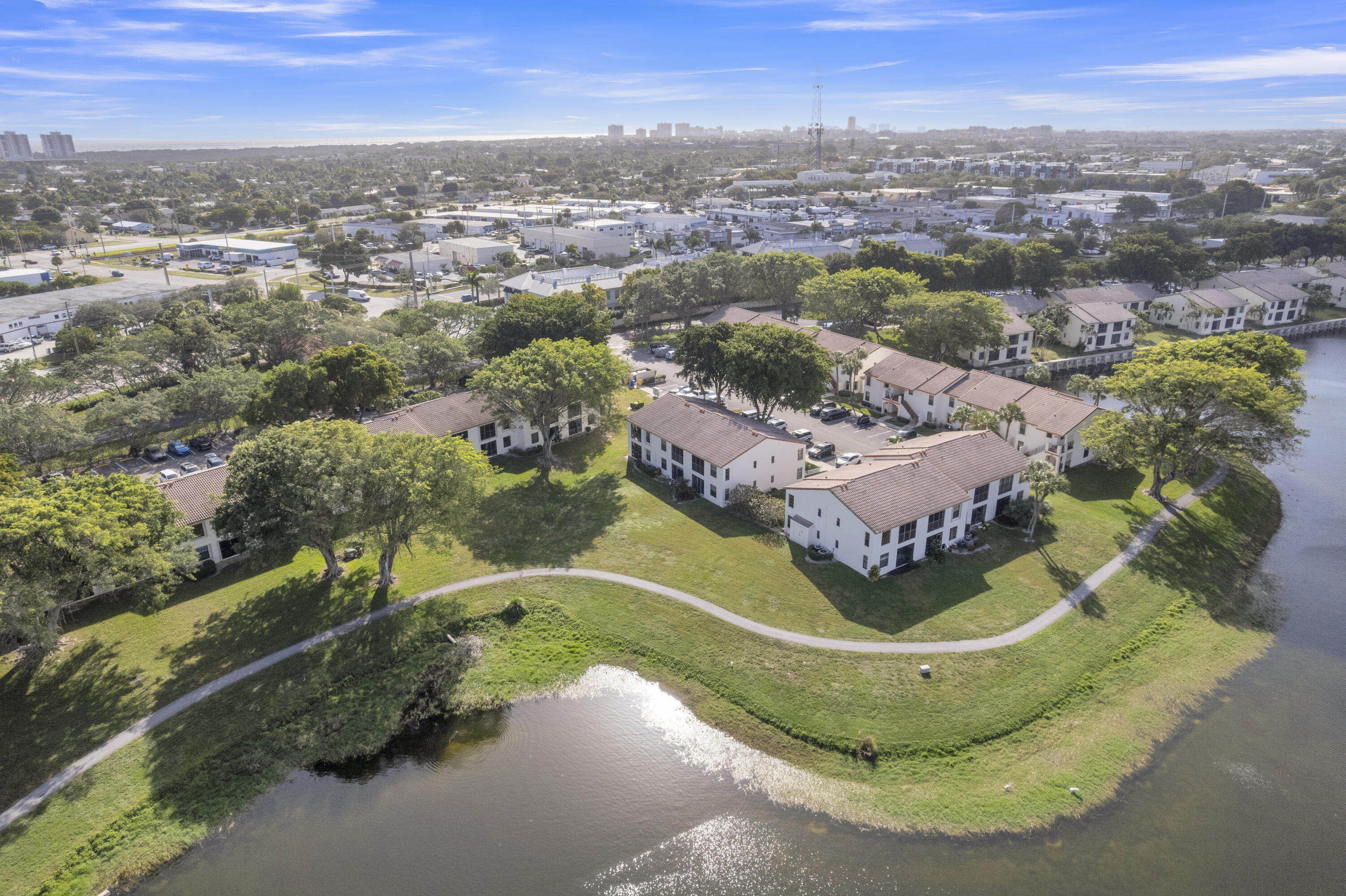 2800 Palmwood Terrace, Unit 2190 Boca Raton, FL 33431 - Photo 3 of 42 an aerial view of a house with a yard and lake view