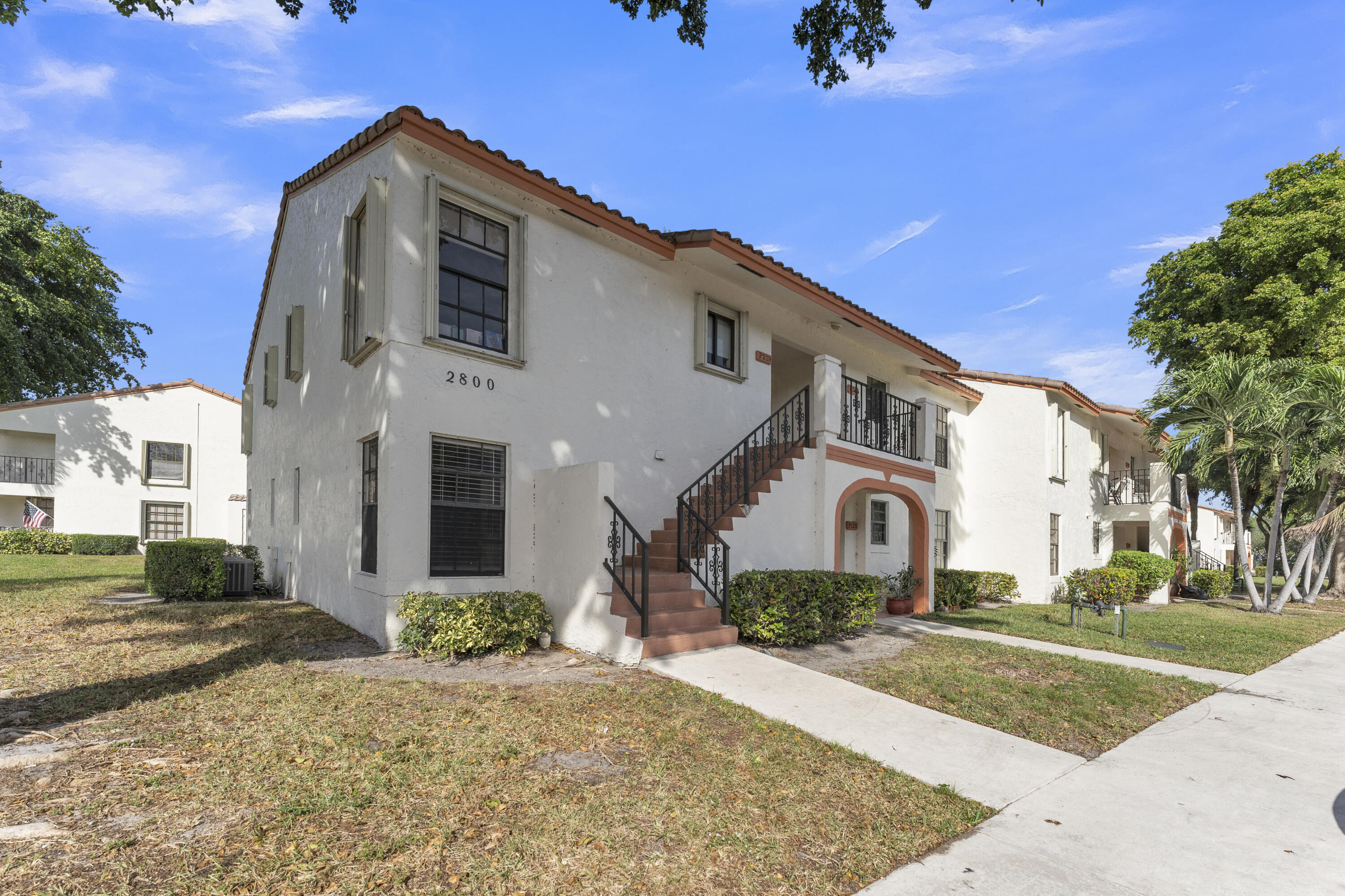 2800 Palmwood Terrace, Unit 2190 Boca Raton, FL 33431 - Photo 35 of 42 a front view of a house with a yard