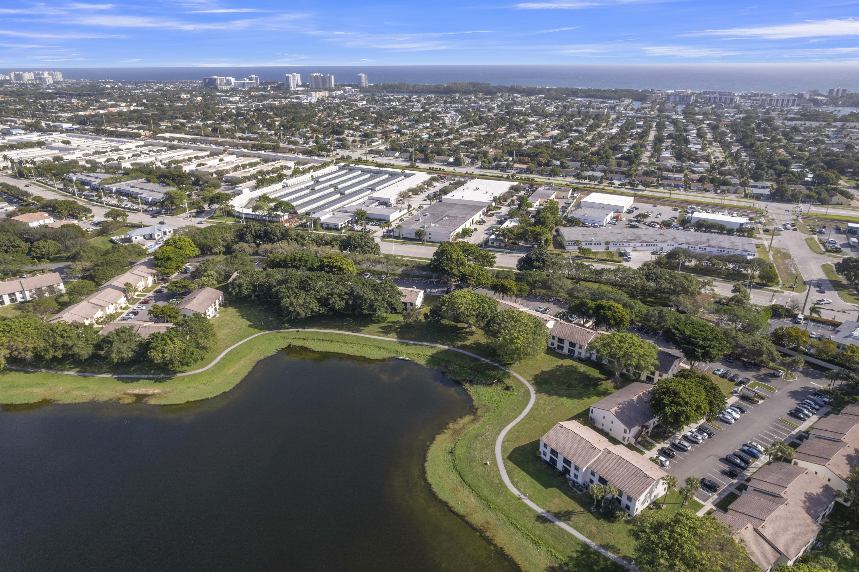 2800 Palmwood Terrace, Unit 2190 Boca Raton, FL 33431 - Photo 39 of 42 an aerial view of residential houses with outdoor space and trees