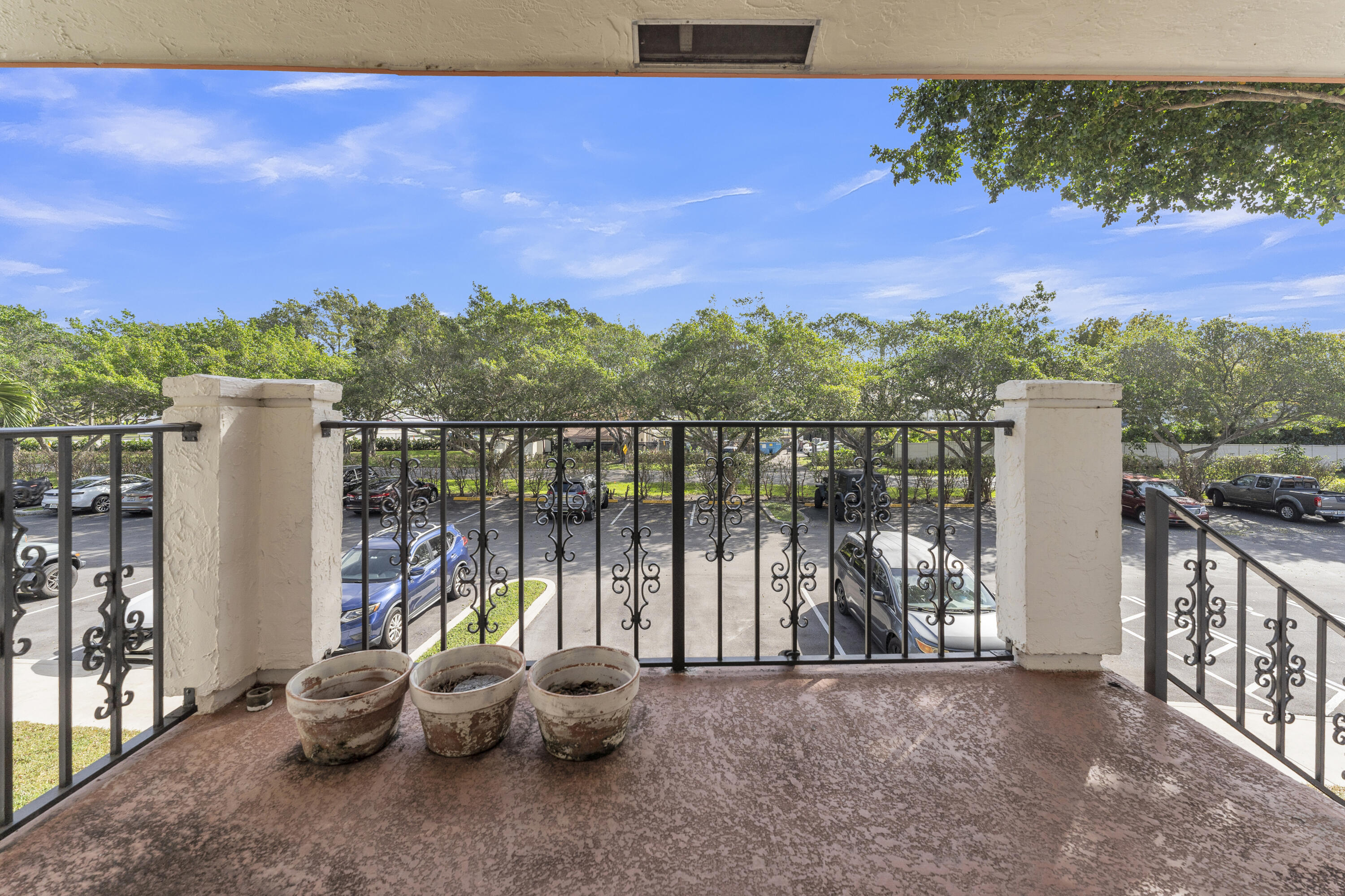 2800 Palmwood Terrace, Unit 2190 Boca Raton, FL 33431 - Photo 8 of 42 a view of a balcony with couches and city view