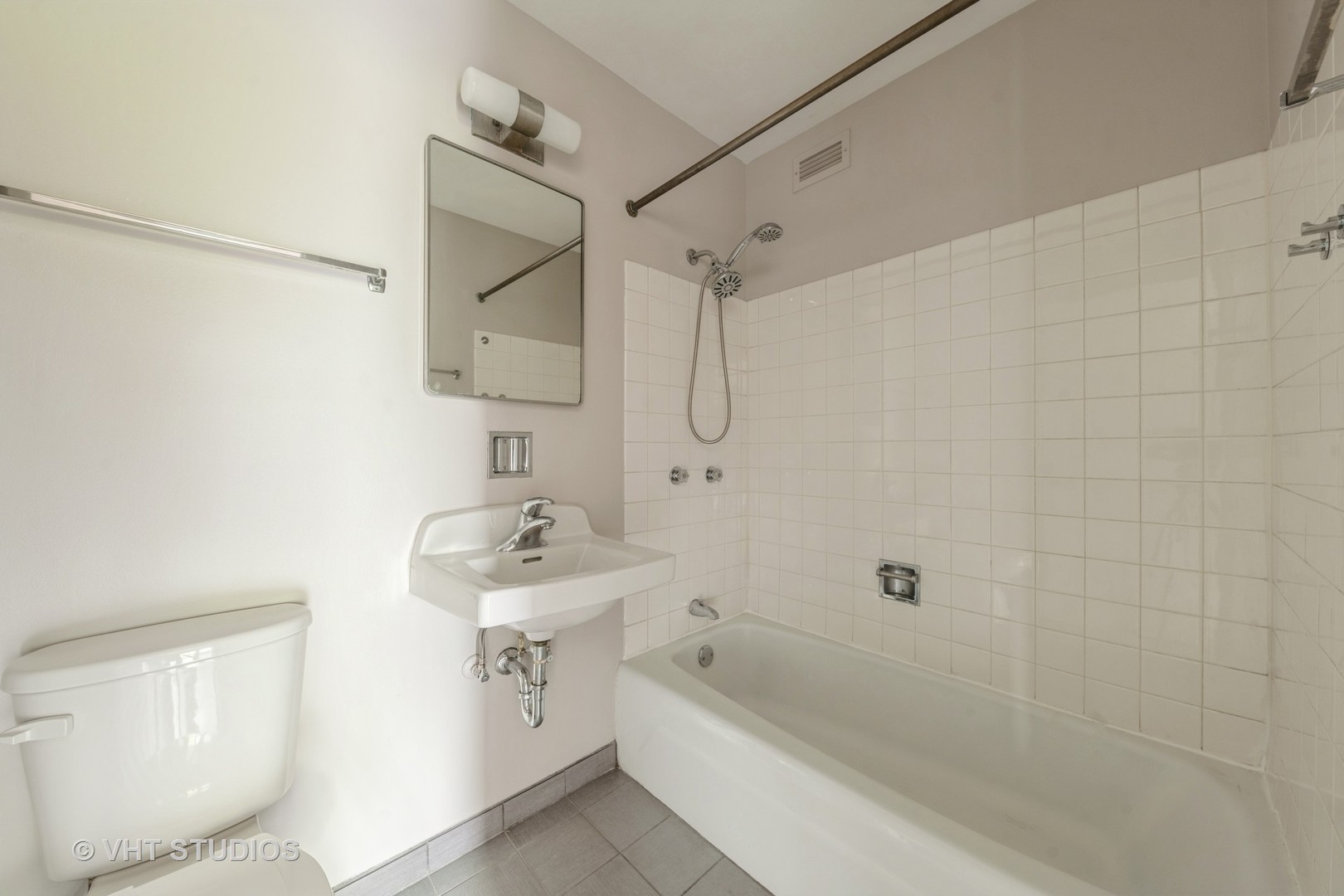 4850 South Lake Park Avenue, Unit 512 Chicago, IL 60615 - Photo 16 of 18 a bathroom with a sink a toilet and shower