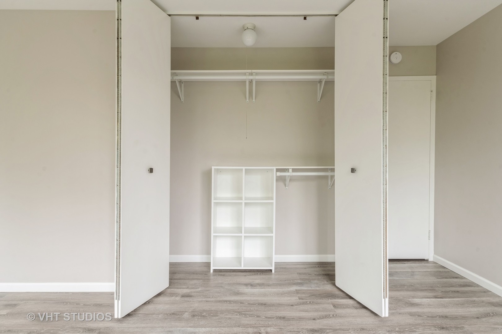 4850 South Lake Park Avenue, Unit 512 Chicago, IL 60615 - Photo 17 of 18 a view of an empty walk in closet with wooden floor