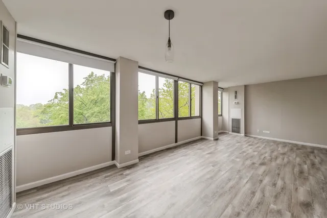 a view of an empty room with a window