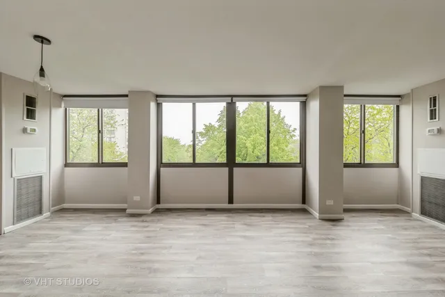 a view of an empty room with a window