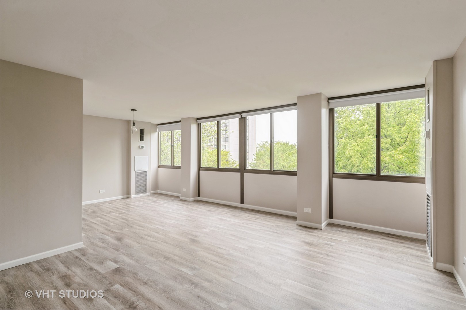 4850 South Lake Park Avenue, Unit 512 Chicago, IL 60615 - Photo 7 of 18 a view of an empty room with glass door and balcony