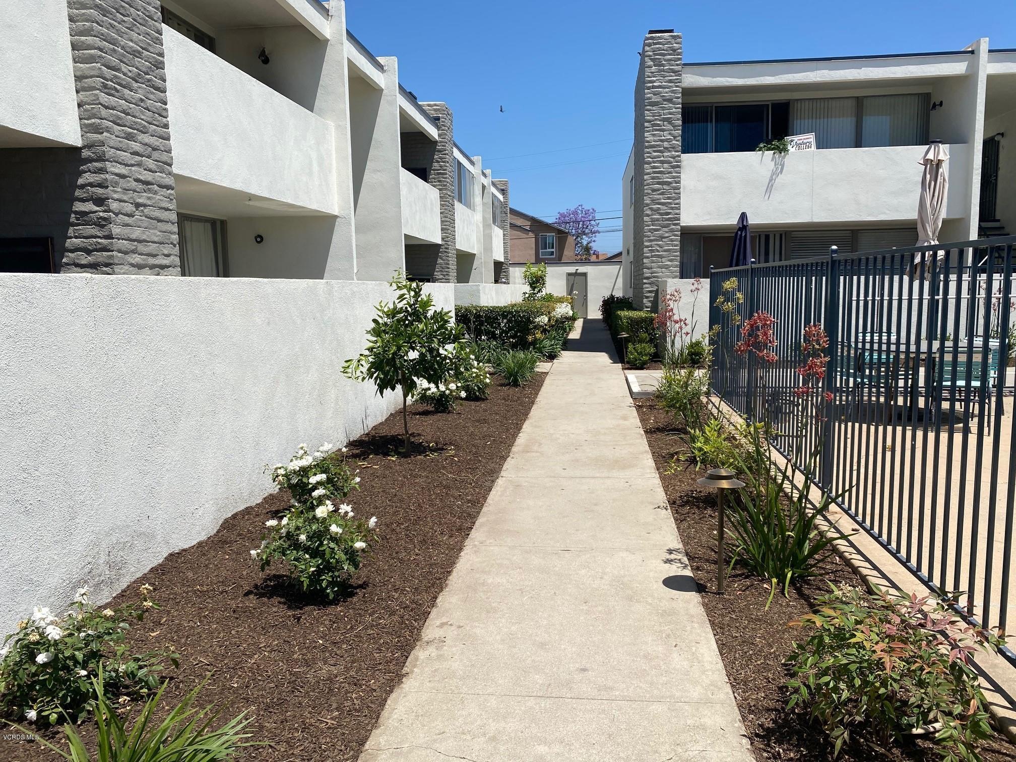 1367 Edgewood Way, Unit 67 Oxnard, CA 93030 - Photo 11 of 13 a view of a pathway with a house