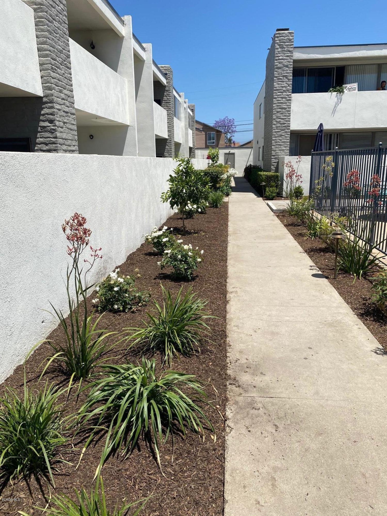 1367 Edgewood Way, Unit 67 Oxnard, CA 93030 - Photo 13 of 13 a view of a back yard of the house