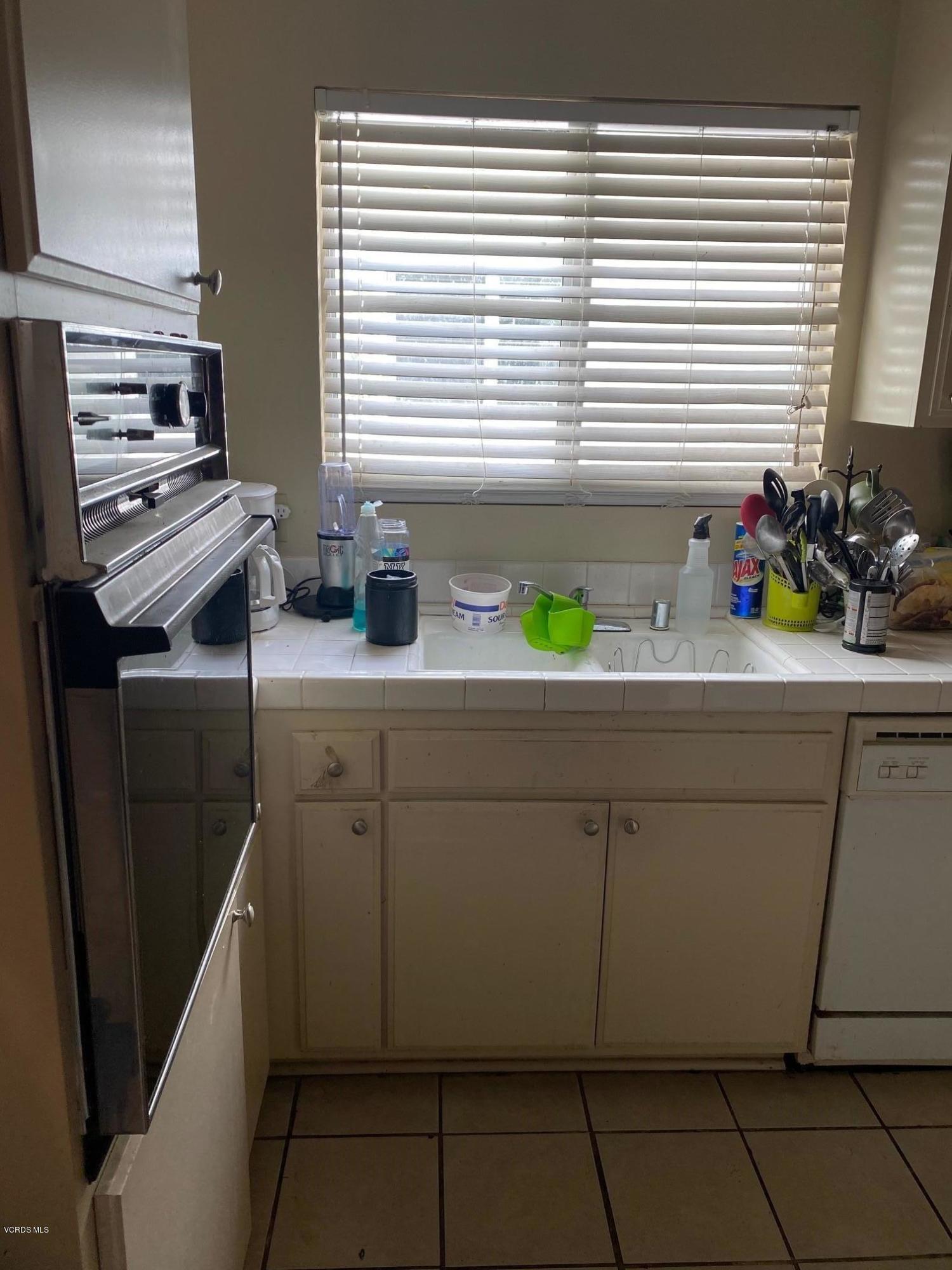 1367 Edgewood Way, Unit 67 Oxnard, CA 93030 - Photo 8 of 13 a bathroom with a sink a vanity and a window