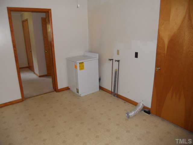 8515 Ten-Ten Road Raleigh, NC 27603 - Photo 8 of 8 an empty room with windows