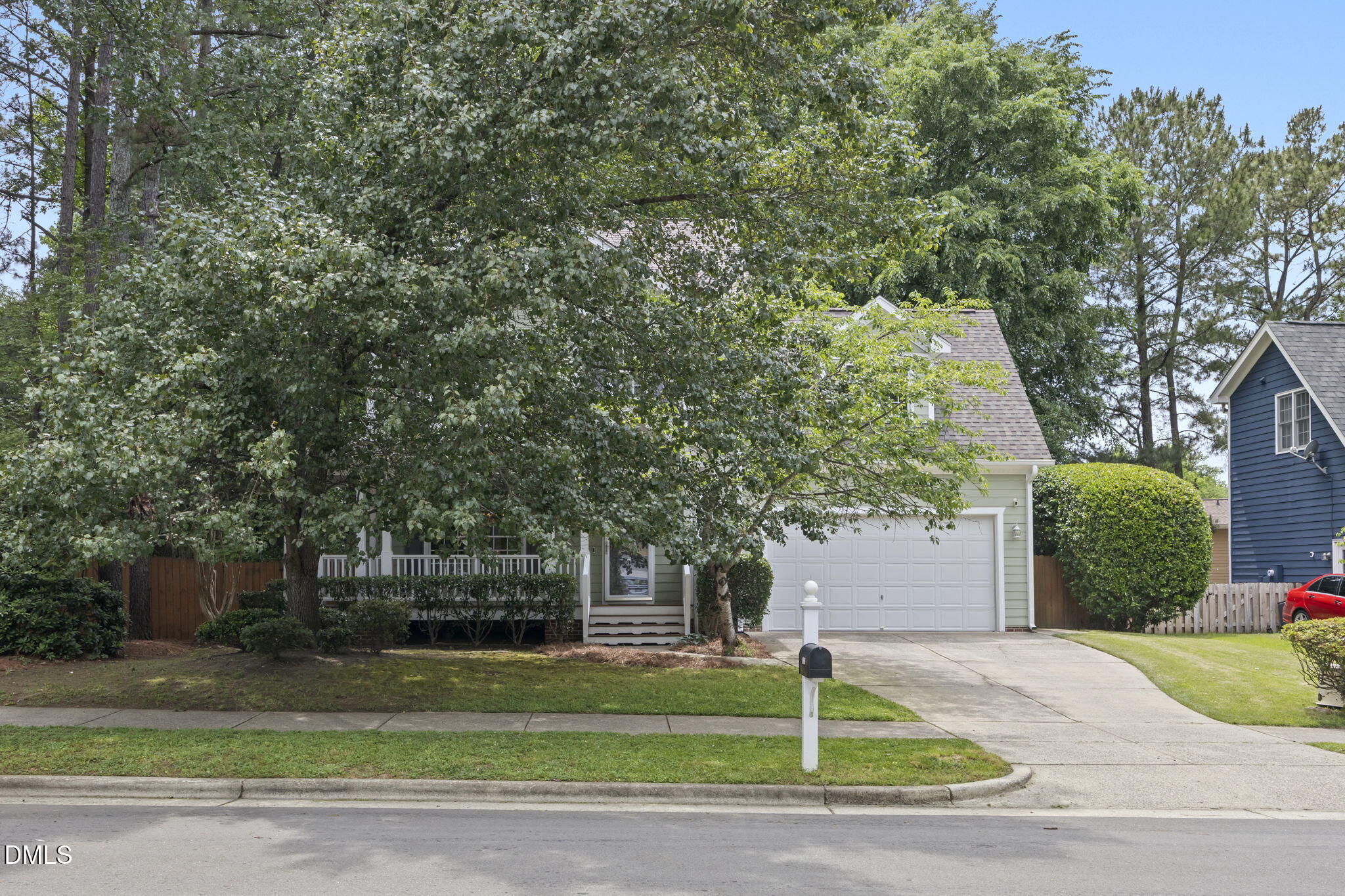 1008 Scotts Ridge Trail Apex, NC 27502 - Photo 4 of 57 a front view of a house with a yard and garage
