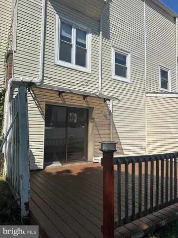 a view of a balcony with wooden floor
