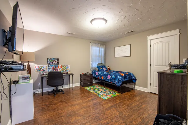 a bathroom with a double vanity sink toilet and shower