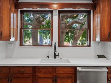 a kitchen with stainless steel appliances granite countertop a refrigerator and a sink