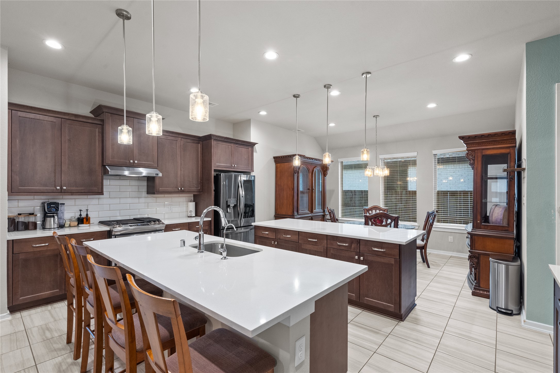 5814 Lavaca Lane Manvel, TX 77578 - Photo 11 of 37 a kitchen with counter space appliances and a living room