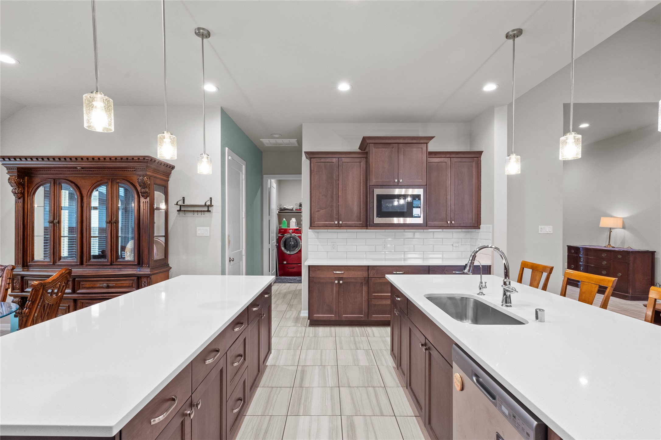 5814 Lavaca Lane Manvel, TX 77578 - Photo 13 of 37 a large kitchen with kitchen island a sink stove and refrigerator
