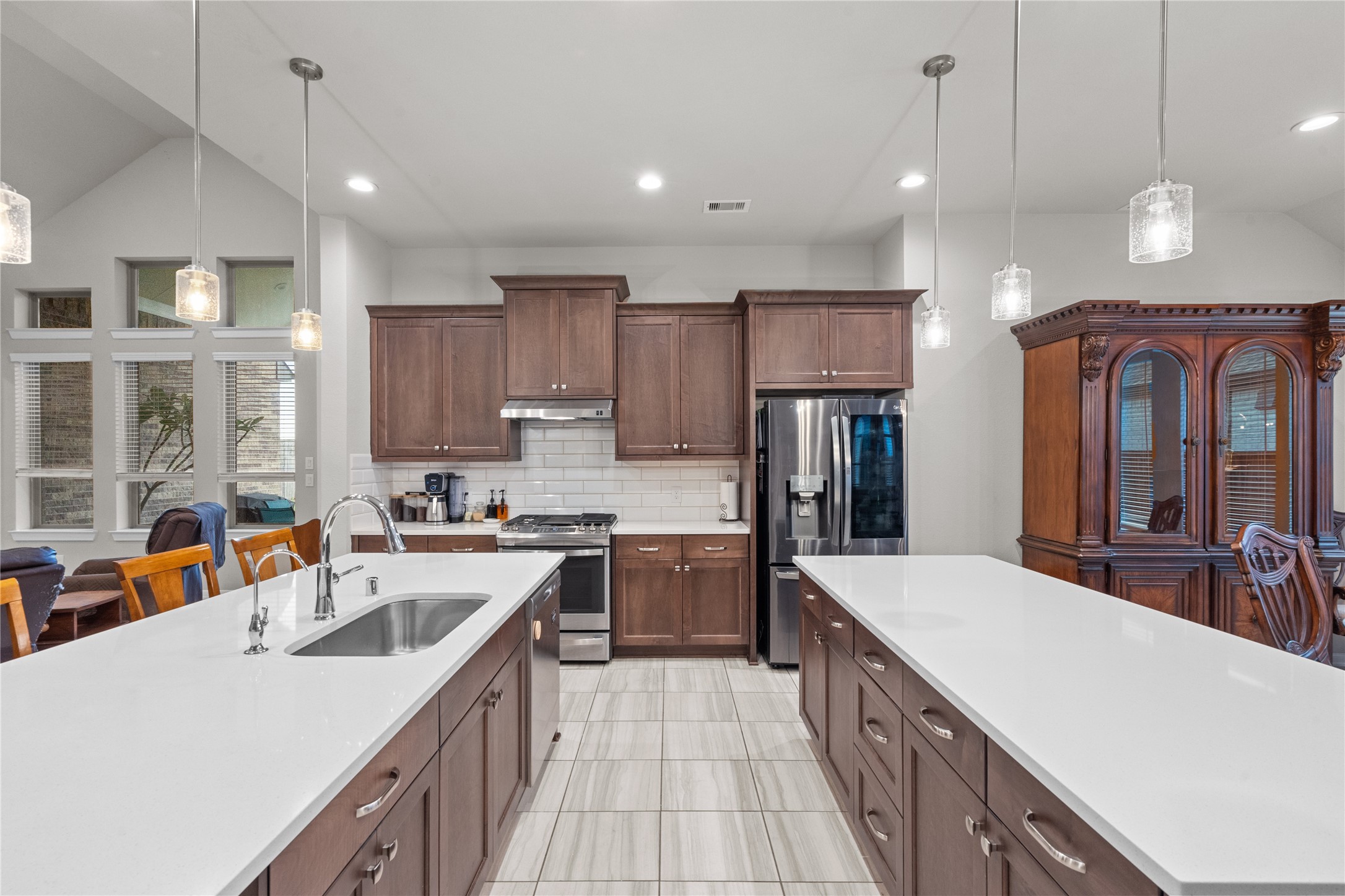 5814 Lavaca Lane Manvel, TX 77578 - Photo 14 of 37 a open kitchen with stainless steel appliances granite countertop a sink stove and refrigerator