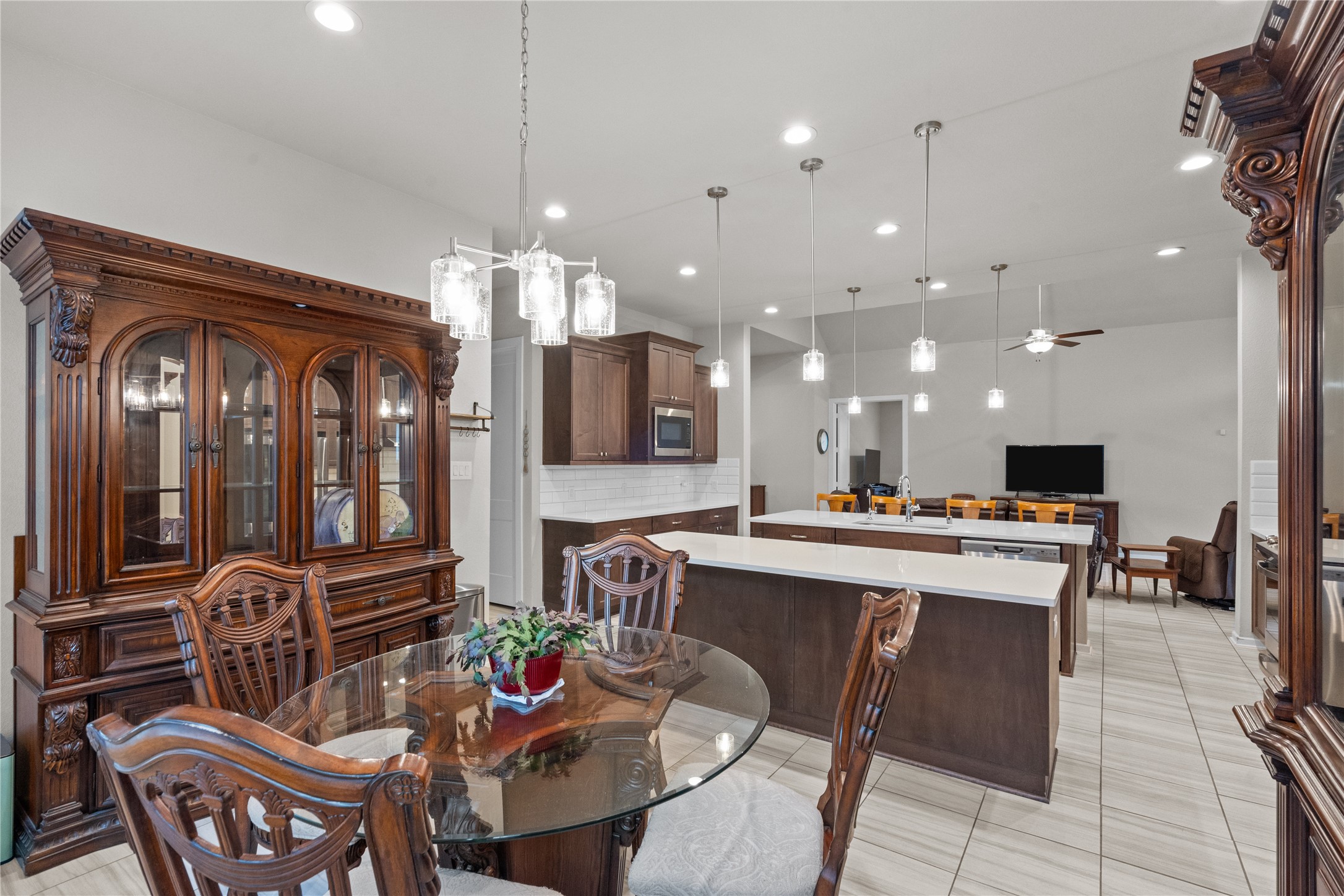 5814 Lavaca Lane Manvel, TX 77578 - Photo 17 of 37 a view of a dining room and livingroom with furniture wooden floor a chandelier