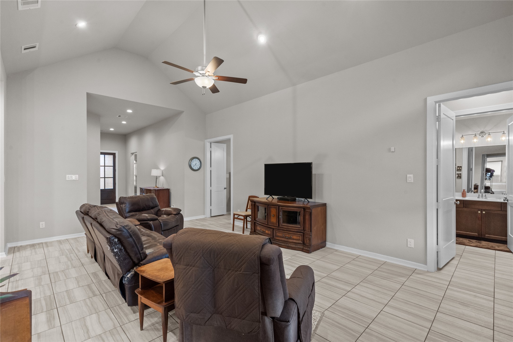5814 Lavaca Lane Manvel, TX 77578 - Photo 19 of 37 a living room with furniture and a flat screen tv
