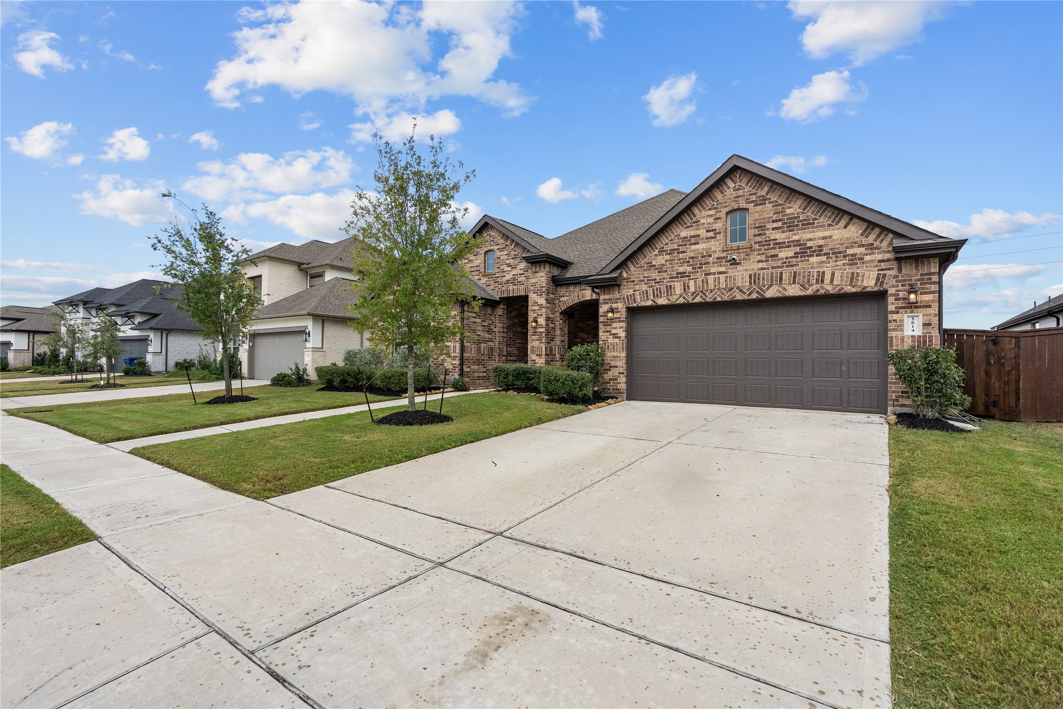 5814 Lavaca Lane Manvel, TX 77578 - Photo 2 of 37 a view of a house with a big yard plants and large tree