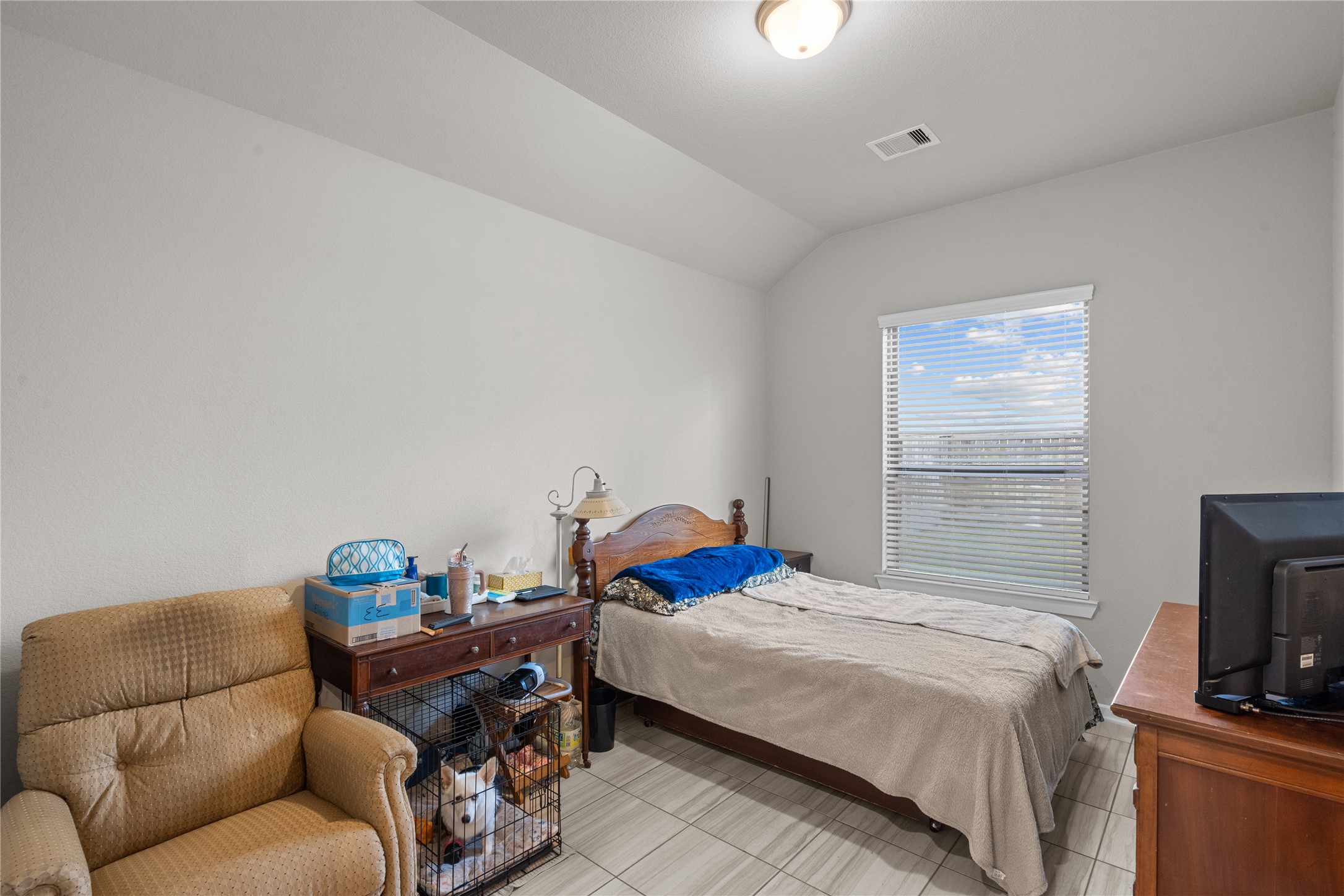 5814 Lavaca Lane Manvel, TX 77578 - Photo 31 of 37 a bedroom with a bed and a couch