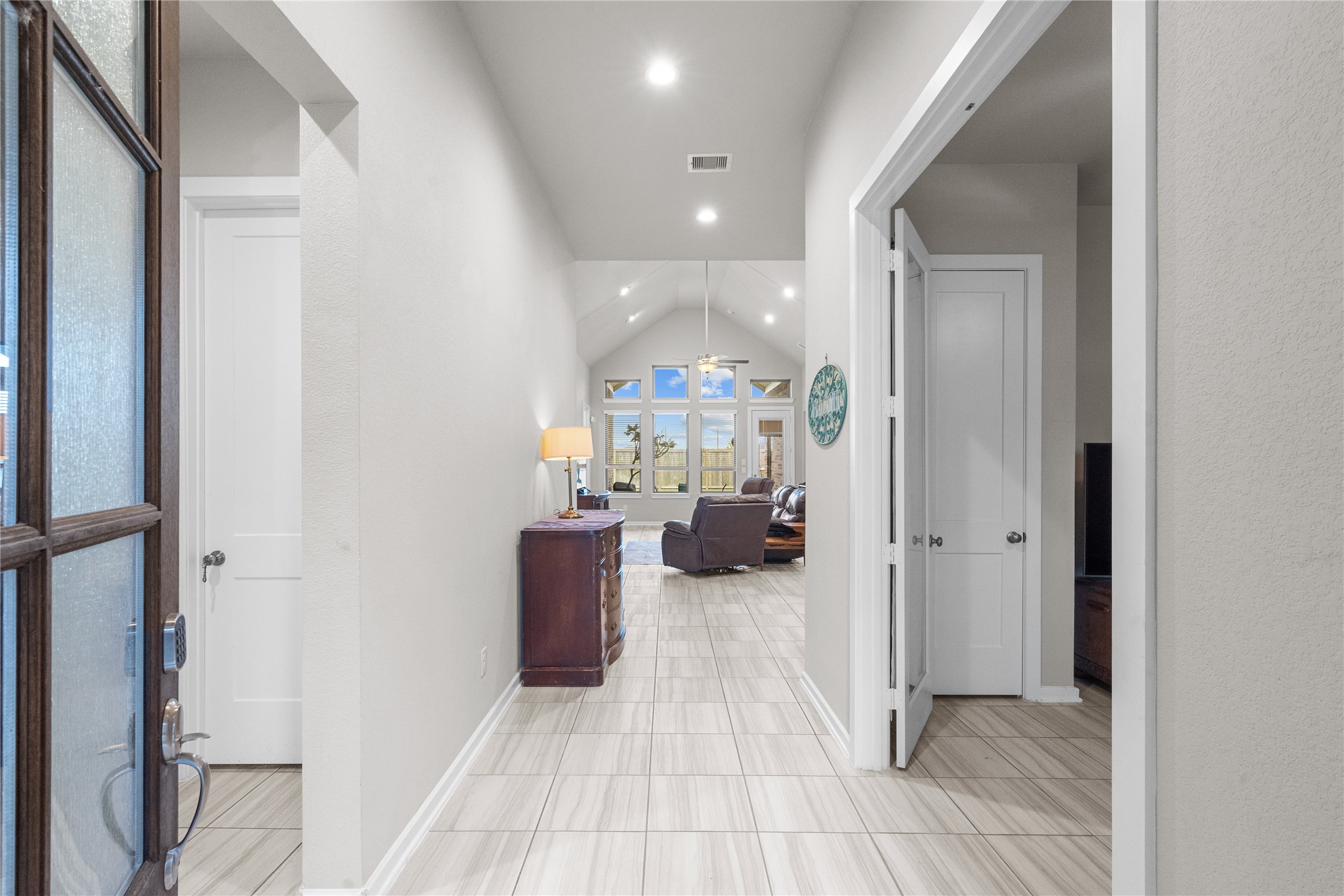 5814 Lavaca Lane Manvel, TX 77578 - Photo 4 of 37 a view of a hallway with dining room and furniture