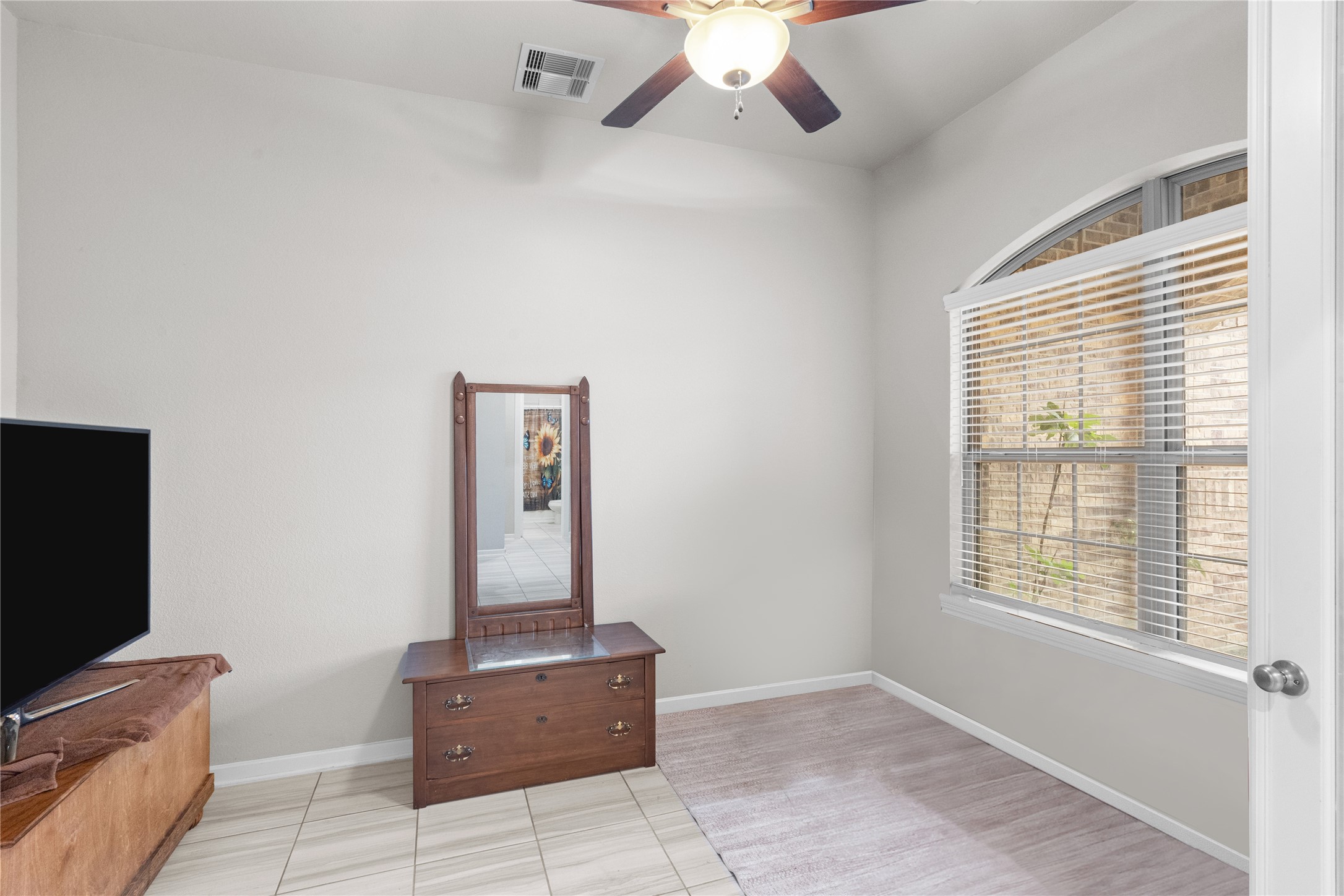 5814 Lavaca Lane Manvel, TX 77578 - Photo 5 of 37 a living room with furniture and flat screen tv