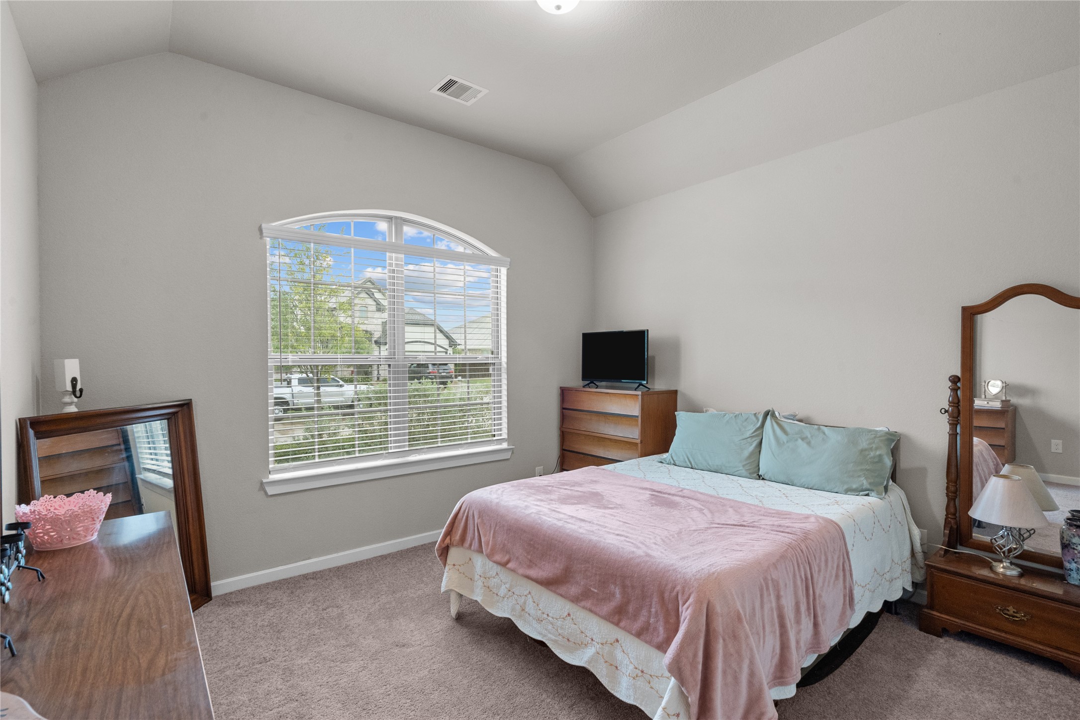 5814 Lavaca Lane Manvel, TX 77578 - Photo 8 of 37 a bedroom with a bed and a tv