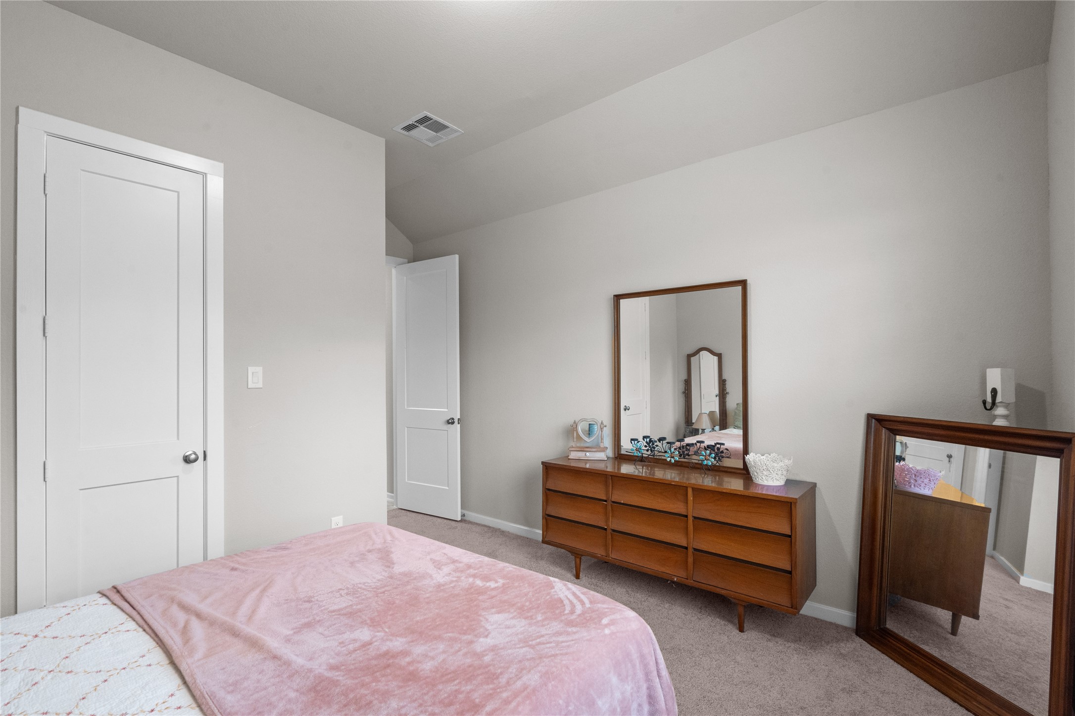 5814 Lavaca Lane Manvel, TX 77578 - Photo 9 of 37 a bedroom with a bed and a mirror