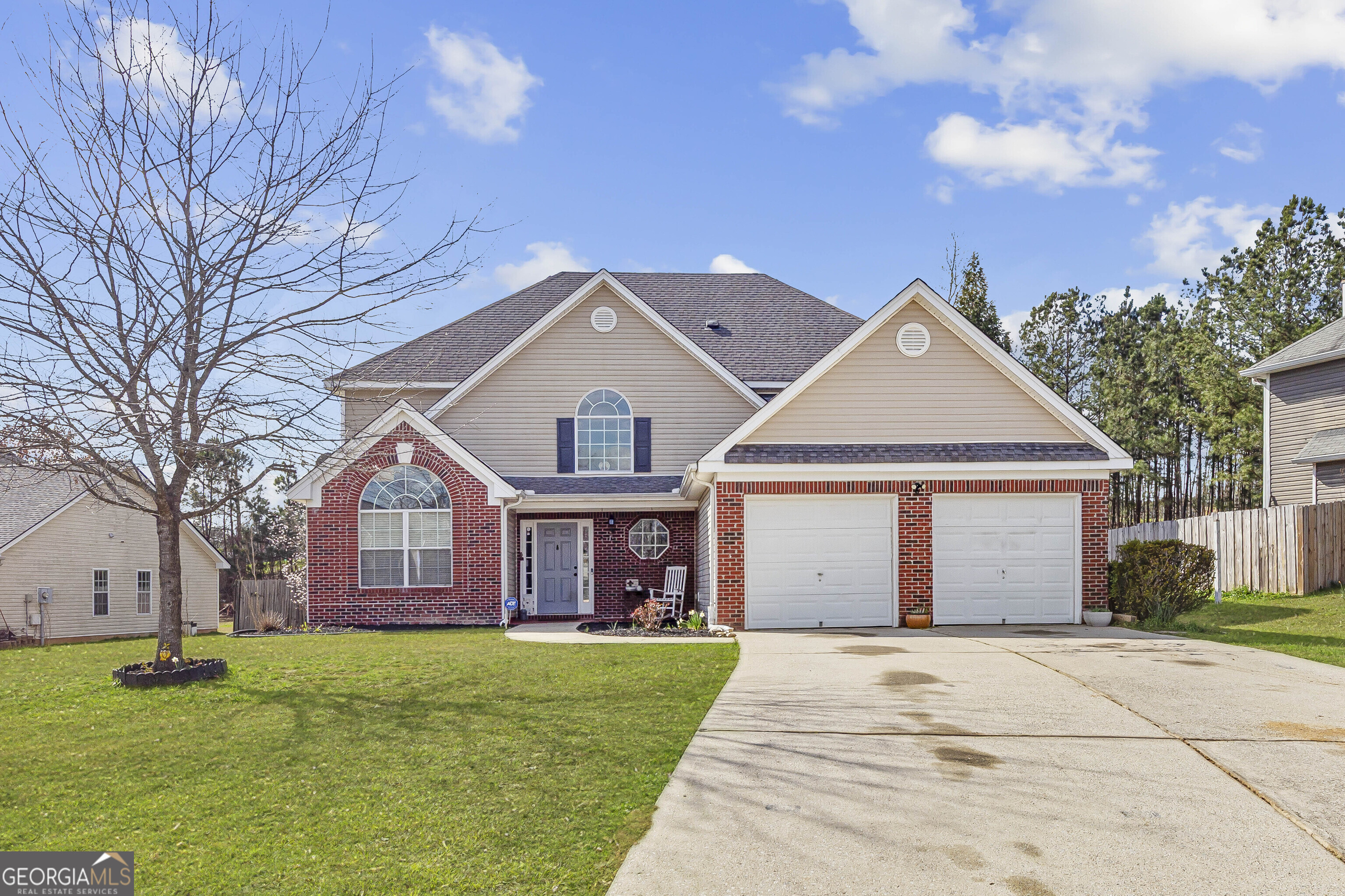 2301 Vineyard Court Villa Rica, GA 30180 - Photo 1 of 1 a front view of a house with a garden