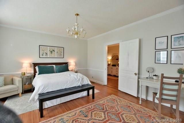 3225 Harmony Road Catawba, SC 29704 - Photo 15 of 27 a bedroom with a bed and a chandelier