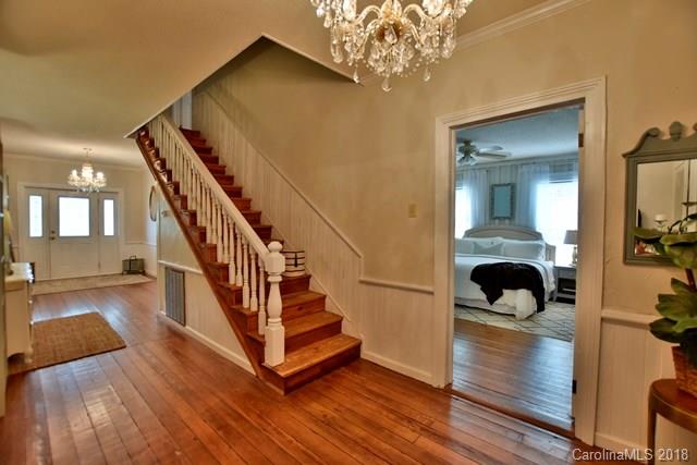 3225 Harmony Road Catawba, SC 29704 - Photo 17 of 27 a view of a hallway with wooden floor and staircase