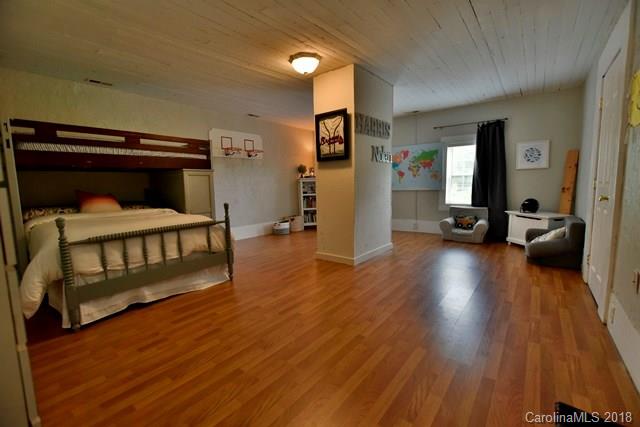 3225 Harmony Road Catawba, SC 29704 - Photo 19 of 27 a bedroom with a bed and wooden floor