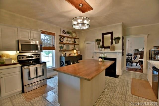 3225 Harmony Road Catawba, SC 29704 - Photo 7 of 27 a kitchen with stainless steel appliances granite countertop a sink dishwasher stove and refrigerator with wooden floor
