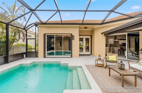 a view of a backyard with sitting area