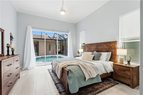 a bedroom with bed and window
