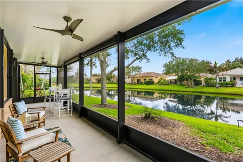 a view of swimming pool with furniture