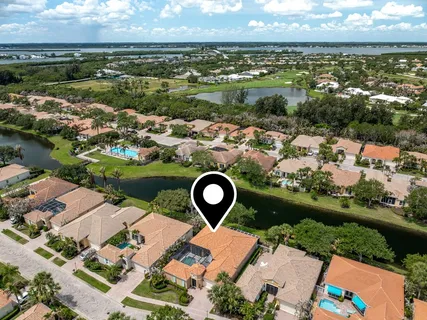 an aerial view of a house with a lake view