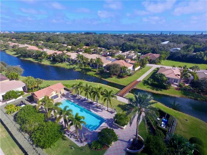 an aerial view of a houses and an outdoor space