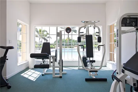 a room with gym equipment and a large window