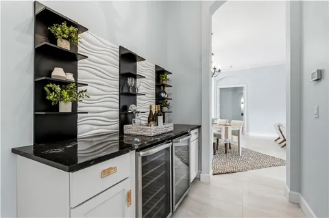 a kitchen with stainless steel appliances kitchen island a stove and a refrigerator