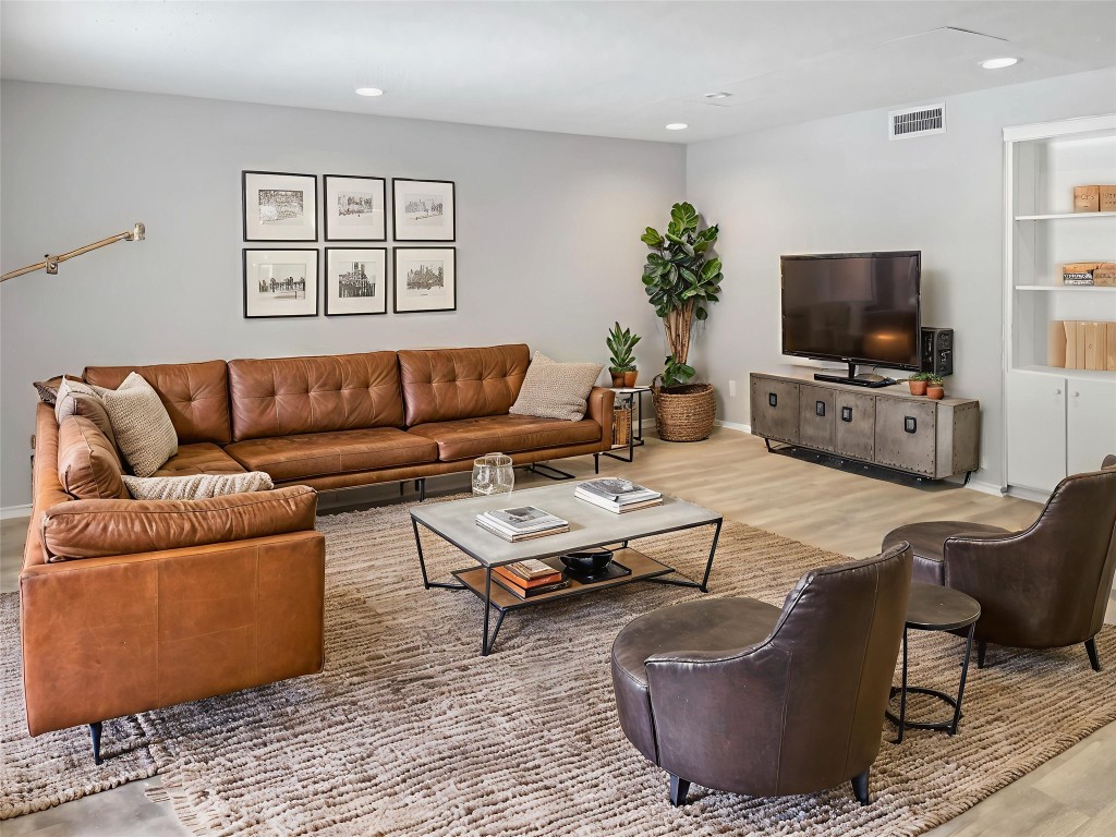 2401 Leon Street, Unit 110 Austin, TX 78705 - Photo 5 of 13 Living room with light wood-style flooring and recessed lighting