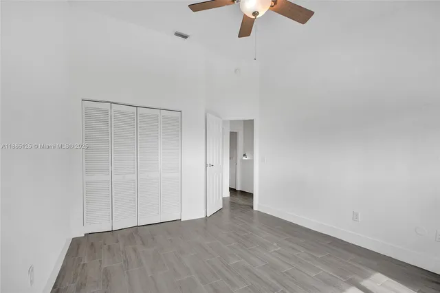 a bathroom with a sink vanity mirror and toilet