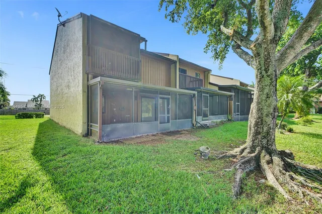 a view of a lake with houses in the back