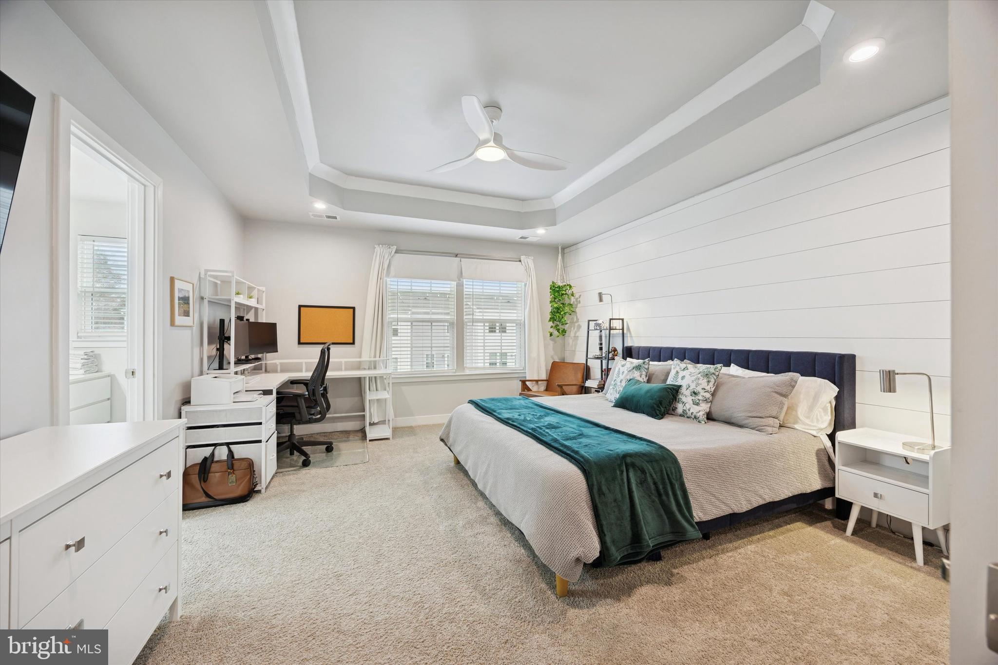 135 Bishop Way Dublin, PA 18917 - Photo 14 of 24 a spacious bedroom with a bed a table and large windows