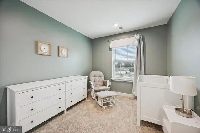 a bedroom with a bed and a table in it