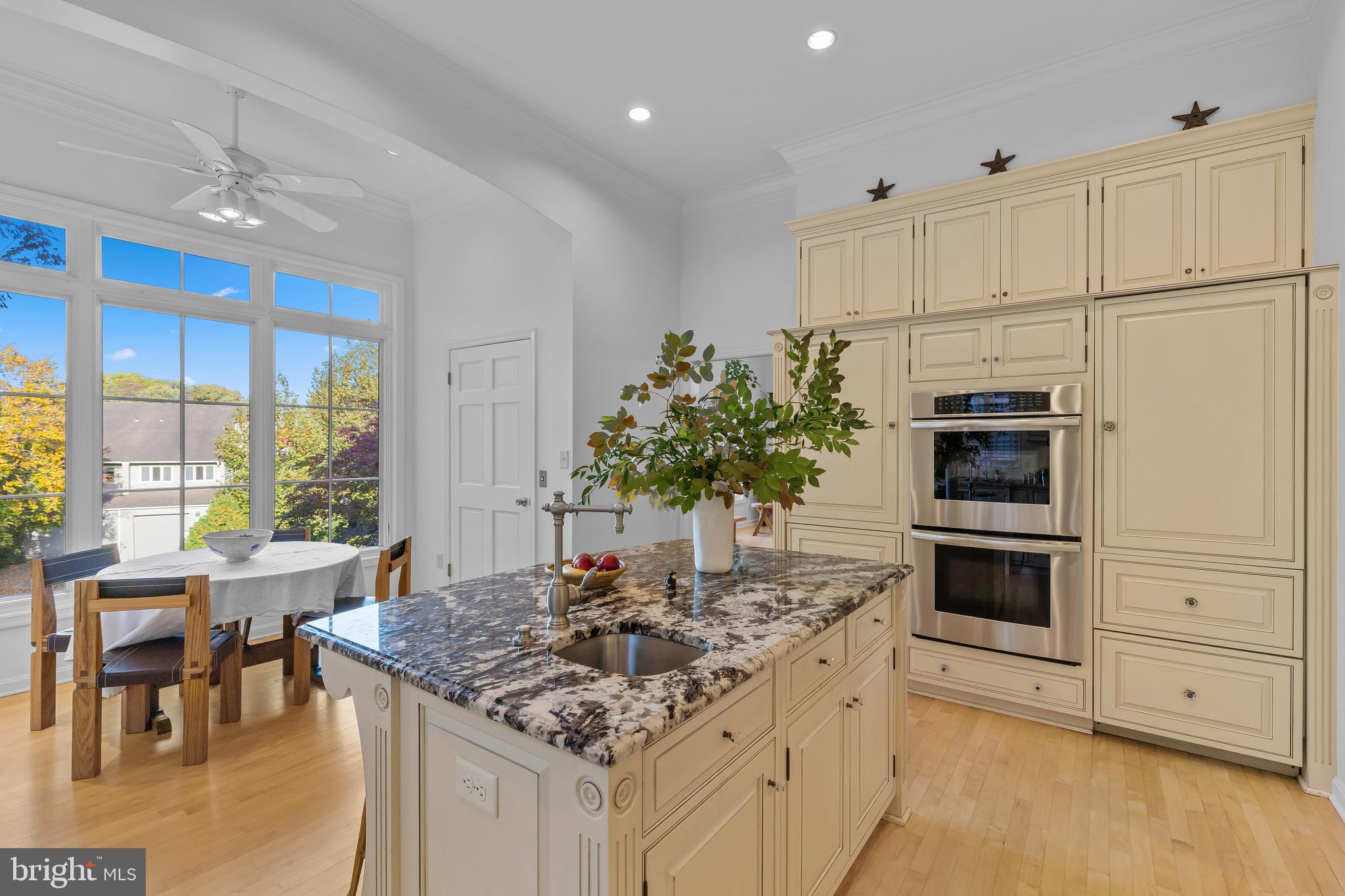 2 Southgate Avenue, Unit 10 Annapolis, MD 21401 - Photo 20 of 41 a kitchen with stainless steel appliances kitchen island granite countertop a stove a sink and a white cabinets
