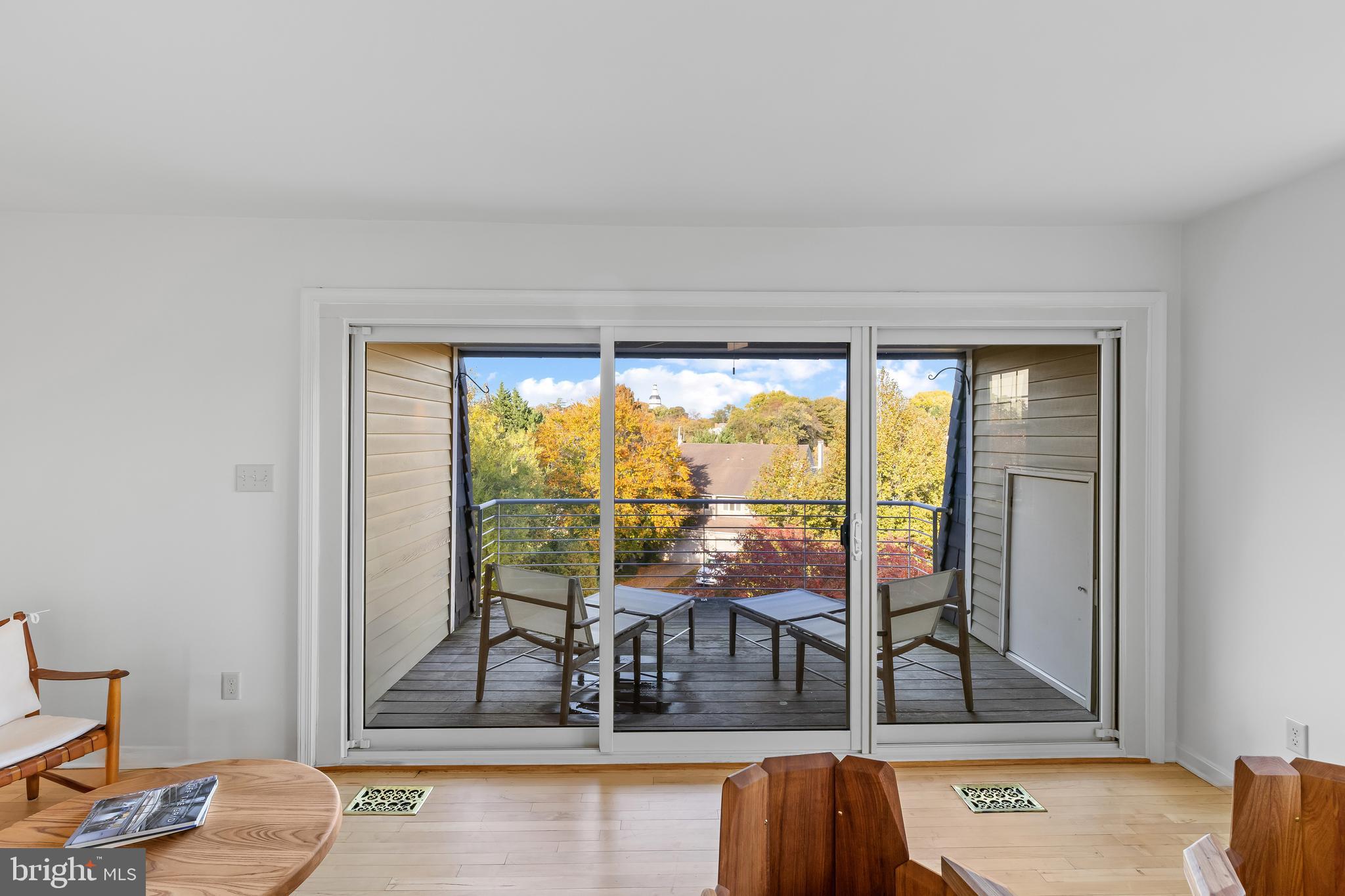 2 Southgate Avenue, Unit 10 Annapolis, MD 21401 - Photo 30 of 41 a living room with large glass windows and furniture