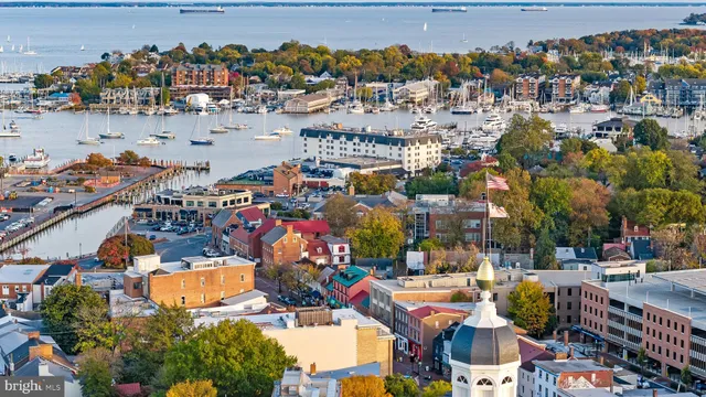 an aerial view of a houses with outdoor seating