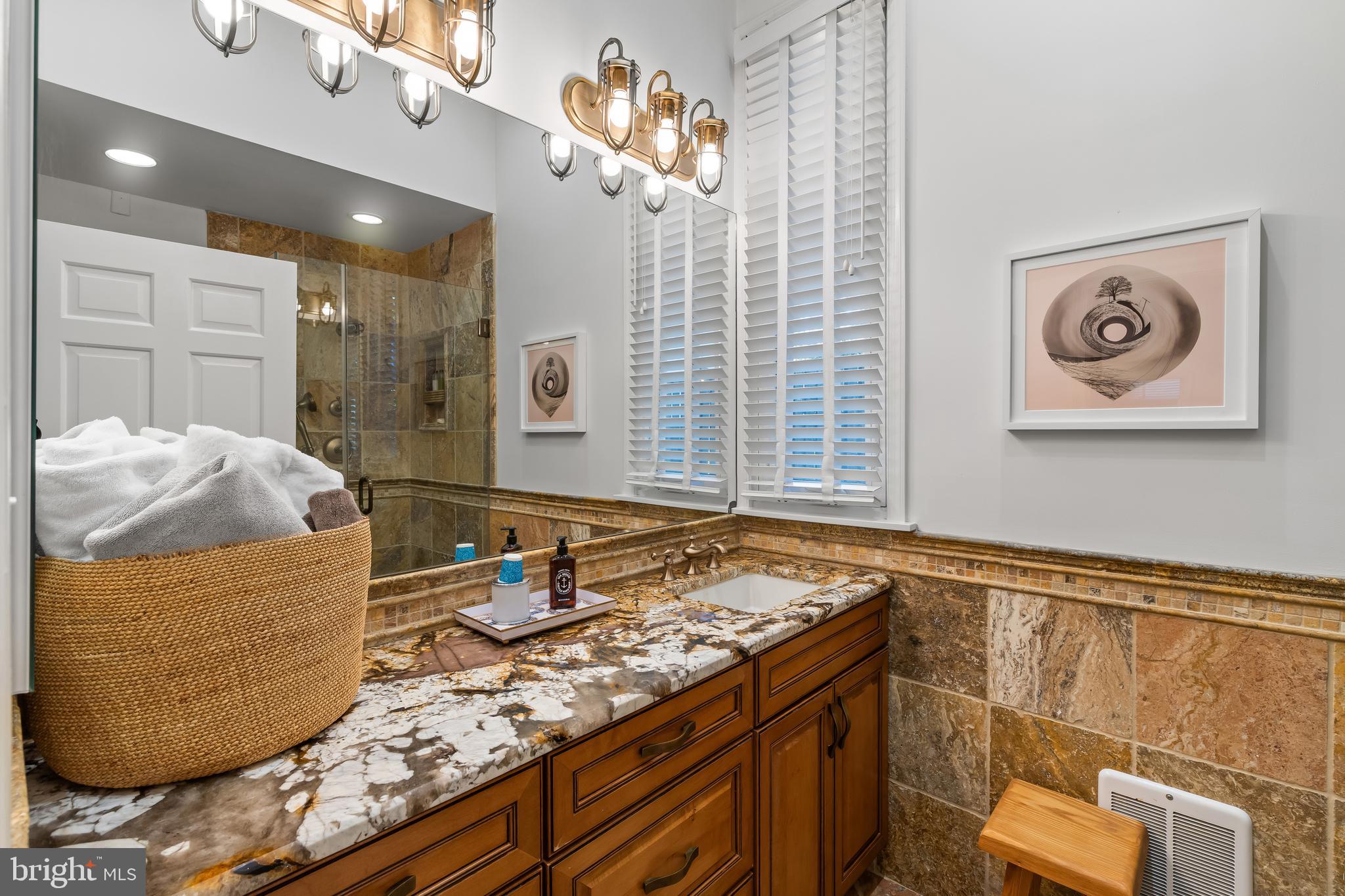 2 Southgate Avenue, Unit 10 Annapolis, MD 21401 - Photo 8 of 41 a living room with granite countertop furniture and a chandelier
