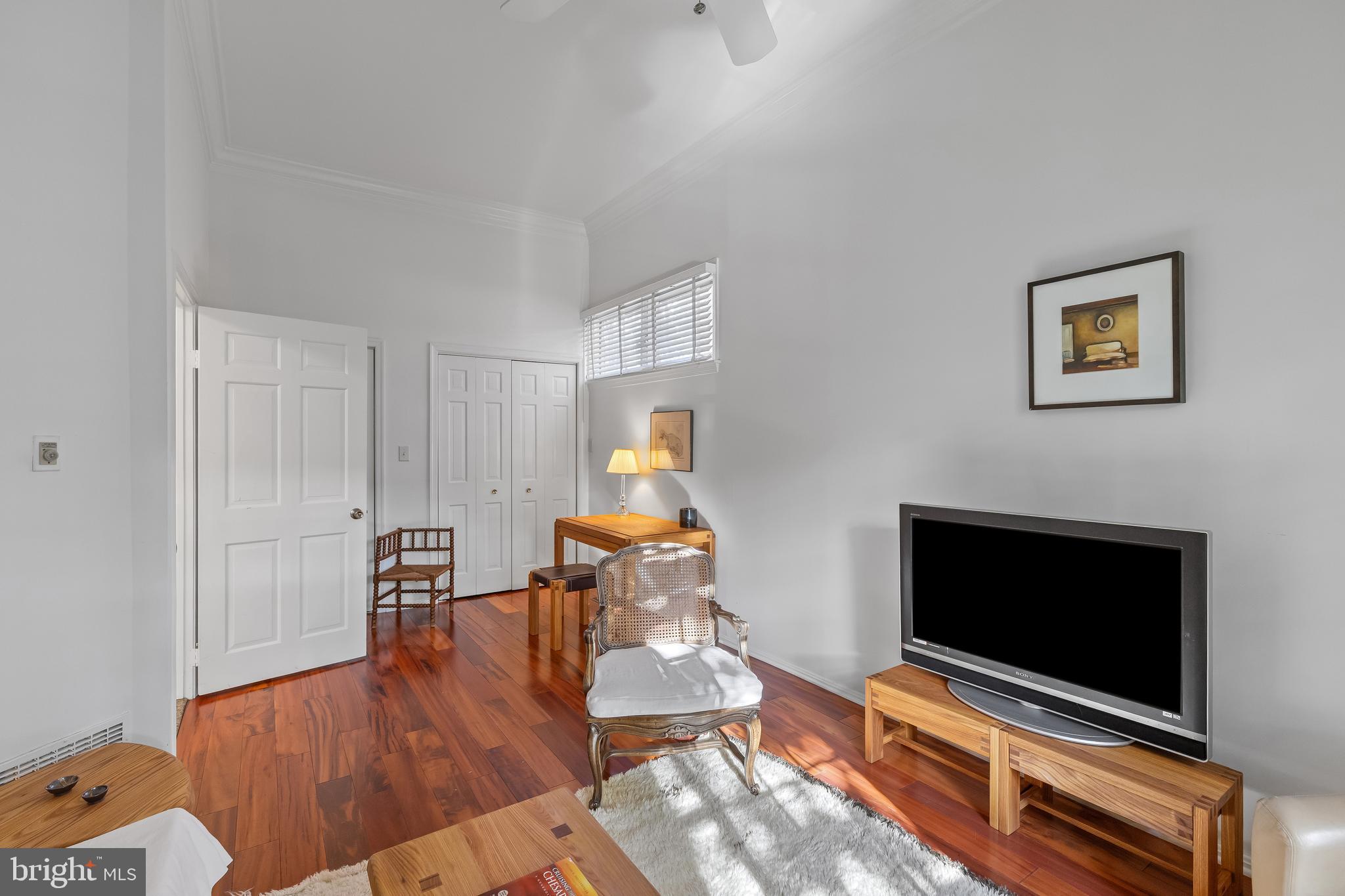 2 Southgate Avenue, Unit 10 Annapolis, MD 21401 - Photo 9 of 41 a living room with furniture and a flat screen tv